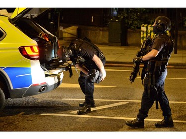 Armed police officers arrive at the scene of a terror attack on London Bridge.