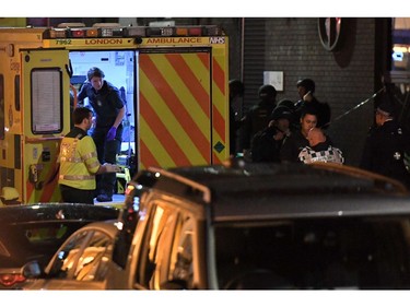 Police and members of the emergency services work at the scene of a terror attack.