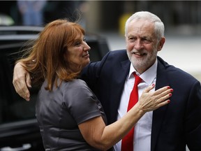 Britain's Labour party leader Jeremy Corbyn is greeted as he arrives at Labour party headquarters in London, Friday, June 9, 2017. British Prime Minister Theresa May's gamble in calling an early election backfired spectacularly, as her Conservative Party lost its majority in Parliament and pressure mounted on her Friday to resign.