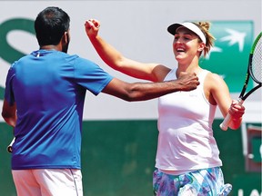 Gabriela Dabrowski and India's Rohan Bopanna celebrate winning their mixed doubles final match against Anna-Lena Groenefeld of Germany and Robert Farah of Colombia.