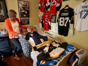 Stephanie and Matthew Paravan share some time together at their home in Ottawa Ontario Monday June 5, 2017. Matthew suffers from debilitating seizures, sometimes hundreds a day, and is a complex needs patients. His mother, Stephanie, will speak to us about how she manages that care, and how she's looking forward to a new CHEO plan, being unveiled Tuesday, to ease that burden.