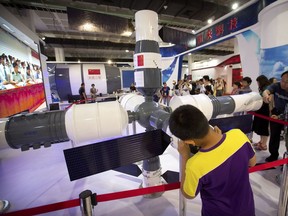 Visitors look at a model of China's Tiangong-1 space station at the China Beijing International High-Tech Expo in Beijing, Saturday, June 10, 2017. Canadian high-tech companies, says Paul Vallée, have an opportunity to attract more foreign talent, and the government is making it easier. (AP Photo/Mark Schiefelbein)