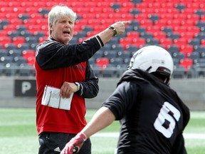 Defensive co-ordinator Mark Nelson directs some on-field traffic during Redblacks practice on Friday.  Julie Oliver/Postmedia