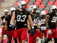 Defensive lineman Jake Ceresna (93) gets into position during a training-camp drill on Monday at TD Place stadium. Julie Oliver/Postmedia