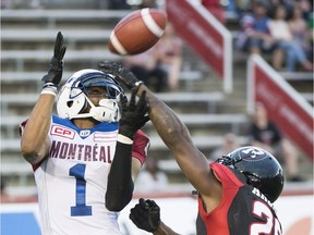 Montreal's Tiquan Underwood (1) makes a touchdown catch against Ottawa defensive back Javier Arenas during the first half of Thursday's game at Molson Stadium. Graham Hughes/THE CANADIAN PRESS