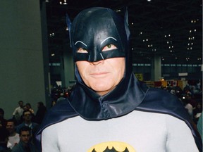 In this Jan. 27, 1989 file photo, actor Adam West dressed as Batman during an appearance at the "World of Wheels" custom car show in Chicago.