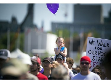 Five-year-old Aubrey Hart on her father Gord Hart's shoulders walked for a friends mother who passed away from ALS.Ashley Fraser/Postmedia