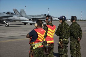 Royal Canadian Air Force (RCAF) CF-188 Hornets and ground crew from 4 Wing Cold Lake, prepare to launch as part of the morning wave of Exercise MAPLE FLAG 50, at 4 Wing Cold Lake, Alberta on May 29, 2017.

Photo: Cpl Justin Roy, 4 Wing Imaging. 
CK07-2017-0460-002