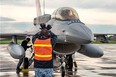 Ground crew from the Republic of Singapore Air Force, 425th Fighter Squadron marshal one of their F-16 Falcon fighters, during Exercise MAPLE FLAG 50, at 4 Wing Cold Lake, on June 9, 2017.
Photo: Cpl Justin Roy, 4 Wing Imaging, 
CK07-2017-0467-012