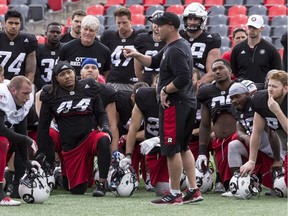 Head coach Rick Campbell addresses his players at the conclusion of a practice during Redblacks training camp at TD Place. May 31, 2017.