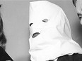 Igor Gouzenko, former Russian embassy code clerk in Ottawa whose disclosure led to cracking a Russian spy ring in Canada in 1946, poses with a pillow-case mask in a Toronto hotel room on April 11, 1954.