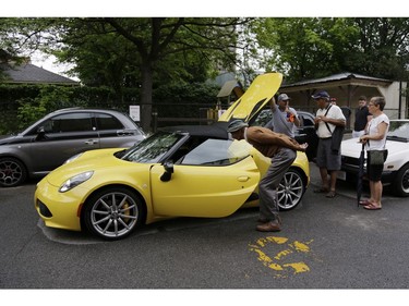 Stylish and sporty Italian cars were parked along the streets of Little Italy for people of all ages to admire and photograph on Saturday, June 17. (David Kawai)

126926
David Kawai