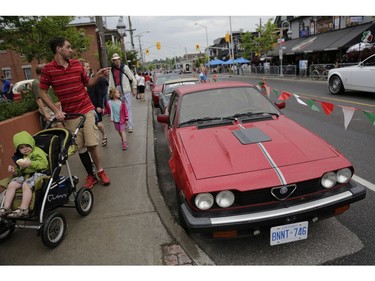 Stylish and sporty Italian cars were parked along the streets of Little Italy for people of all ages to admire and photograph on Saturday, June 17. (David Kawai)

126926
David Kawai