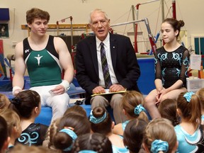 World-acclaimed architect Douglas Cardinal talks to members of the Tumblers Gymnastic club after the announcement of a new world class sports facility is to be built in Orleans, June 15, 2017.