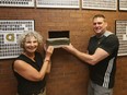 Tim Hunter (R) and Ruth Elias, both teachers at Glashan, hold the time capsule where it was found in the school.
