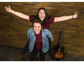 Kristine Shadid, top, and Alli Harris, a female musical comedy duo called Rhythm and Burgundy, pose in the Ottawa Citizen OC Sessions studio Monday, June 5, 2017. The pair are performing at the Ottawa Fringe Festival at Live on Elgin on select dates from June 8 to June 18, 2017. (Darren Brown/Postmedia)