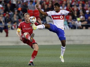 Fury FC captain Lance Rozeboom, left, battles Toronto FC's Armando Cooper for the ball during a Canadian Championship semifinal match in Ottawa on May 23. Because of a knee problem, Rozeboom is listed as a game-time decision for Sunday's USL match against host Bethlehem Steel FC.