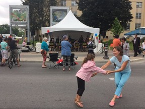 Residents kick up their heels at the official opening of the redone Main Street on Saturday.