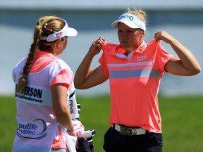 Brooke Henderson of Canada waits with her sister and caddie Brittany on the 18th green during the first round of the Manulife LPGA Classic at Whistle Bear Golf Club on June 08, 2017 in Cambridge, Canada.