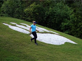 Brooke Henderson of Smiths Falls walks toward the 18th fairway during the third round on Saturday. She shot a 68 and moved into a tie for 14th at 10 under par.