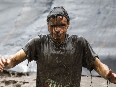 No one was going to finish the Mud Hero obstacles race Sunday June 4, 2017 at Commando Paintball in Navan clean.   Ashley Fraser/Postmedia