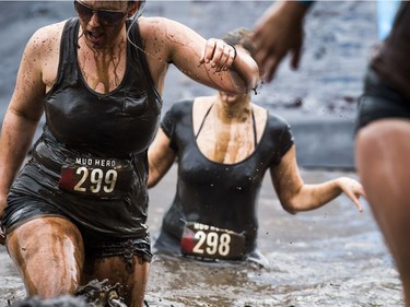 No one was going to finish the Mud Hero obstacles race Sunday June 4, 2017 at Commando Paintball in Navan clean. Jessica Cyr (left) took part in the Ultra 10K.   Ashley Fraser/Postmedia