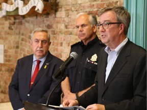 Mayor Jim Watson with Chief Charles Bordeleau and police services board chair Eli El-Chantiry at a press conference in June 2017.