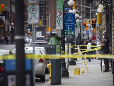 Ottawa Police and the SIU are investigating two fatalities in Ottawa's downtown Saturday June 3, 2017. An Ottawa Police officer stands on Dalhousie between Murray and Clarence.  Ashley Fraser/Postmedia