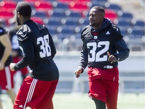 Nicholas Taylor, right, is lining up at linebacker for the Redblacks during training camp. He saw duty at several positions in 2016. Darren Brown/Postmedia