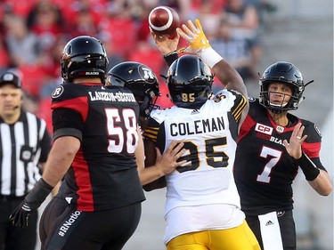 Redblacks QB Trevor Harris passes the ball during the first quarter of play against the Ticats. Harris played only two offensive series, but helped produce 11 points. Tony Caldwell/Postmedia