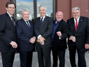 Displaying their Ottawa Sport Hall of Fame rings are, left to right, OSEG Partners Roger Greenberg, John Ruddy, Bill Shenkman, Jeff Hunt and John Pugh.  Tony Caldwell/Postmedia