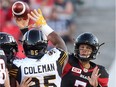 Trevor Harris throws a pass during his brief stint in the Redblacks' home pre-season game against the Tiger-Cats on June 8. Tony Caldwell/Postmedia