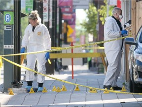 Investigators at the scene of the June 26 slaying of Ashton Dickson outside a Rideau Street bar.