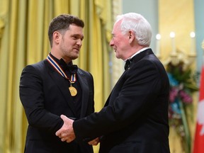Governor General David Johnston presents Michael Buble with the National Arts Centre Award during the Governor General's Performing Arts Awards ceremony at Rideau Hall in Ottawa on Wednesday, June 28, 2017.