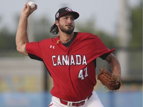 Phillipe Aumont, seen here pitching for Team Canada at the 2015 Pan Am Games, has signed a deal to pitch for the Champions. (Veronica Henri/Postmedia Network)