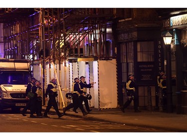 Armed police raid The Blue Eyed Maid in Borough high street at London Bridge.