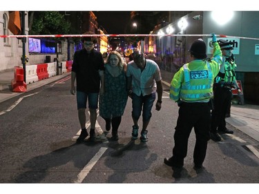 Police officers clear the area near Borough market at London Bridge.