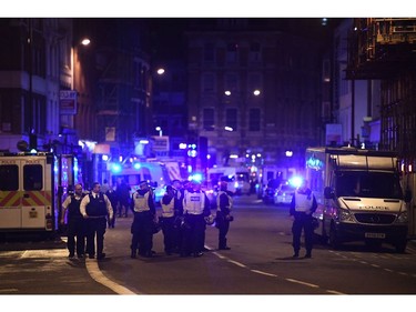 Police at the scene in Borugh high street at London Bridge.