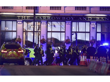 Police officers walking on Borough High Street.