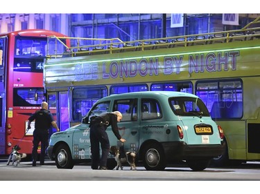 Police sniffer dogs on London Bridge.