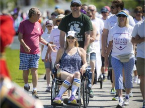Lead walker and ALS Canada ambassador Carol Skinner sets out with her husband Travis and her Live Love Laugh team on Saturday's 5-km walk.