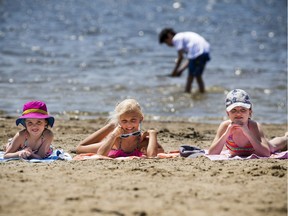 The city's first heat warning of 2017 rolled in on Sunday with temperatures expected to steadily climb and hit 31 degrees C. L-R five-year-old Haley White, seven-year-old Lily Macdonald and eight-year-old Sophia White were excited to enjoy the warm sun on the sand at Mooney's Bay beach.