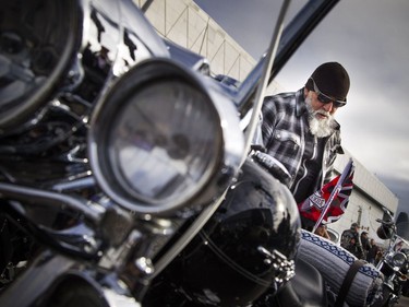 The Telus Ride For Dad kicked off from the Canada Aviation and Space Museum  Saturday June 3, 2017. The ride is to raise funds for prostate cancer research and raising public awareness of the disease. Pepe Valencia gets his bike ready with a Ride For Dad flag Saturday morning.