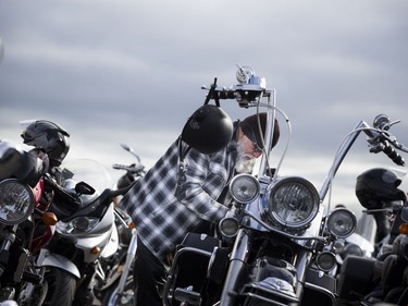 The Telus Ride For Dad kicked off from the Canada Aviation and Space Museum  Saturday June 3, 2017. The ride is to raise funds for prostate cancer research and raising public awareness of the disease. Pepe Valencia gets his bike ready with a Ride For Dad flag Saturday morning.