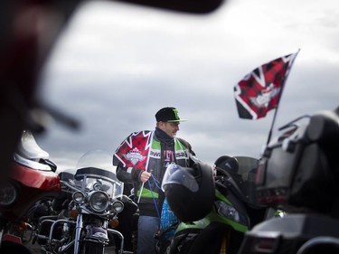 The Telus Ride For Dad kicked off from the Canada Aviation and Space Museum  Saturday June 3, 2017. The ride is to raise funds for prostate cancer research and raising public awareness of the disease. Pierre Cyr gets his bike ready with a Ride For Dad flag Saturday morning.