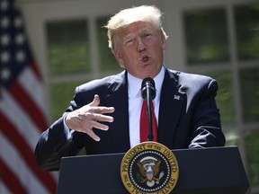 US President Donald Trump announces his decision on the Paris Climate Accords in the Rose Garden of the White House in Washington, DC, on June 1, 2017.      /