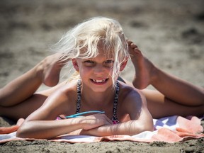 Hurrah! We can expect some  beach weather Saturday. Lily Macdonald, 7, enjoyed 
 a sunny day at Mooney's Bay beach last month, but there haven't been a lot of weekend days without rain since then.