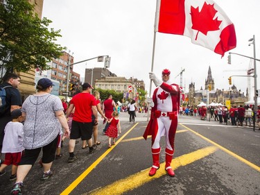 The Ultimate Canadian, Don Estabrook, walks along Wellington St. during Canada Day celebrations in downtown Ottawa Saturday, July 1, 2017.