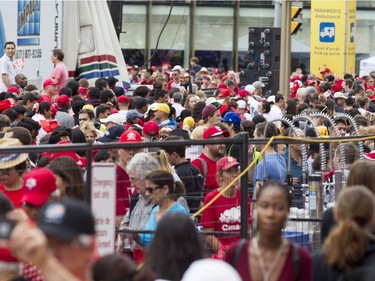 Thousands of people wait to make their way through security checks on Elgin St. near Wellington St. during Canada Day celebrations in downtown Ottawa Saturday, July 1, 2017.