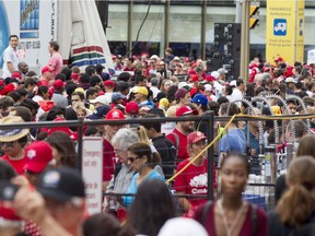 Thousands of people wait to make their way through security checks on Elgin Street near Wellington during Canada Day celebrations in downtown Ottawa Saturday. (Darren Brown/Postmedia)